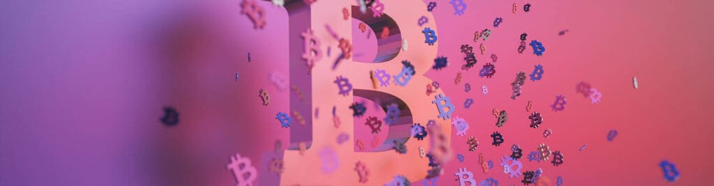 3D big pink bitcoin icon surrounded by small bitcoin icons in different colors