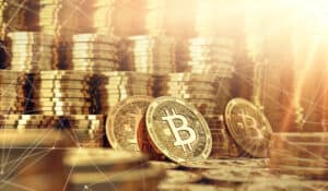 Golden Bitcoin coins and blockchain nodes around in blurry closeup