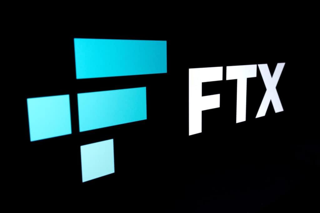 FTX Cryptocurrency Exchange company logo seen on a dark display.