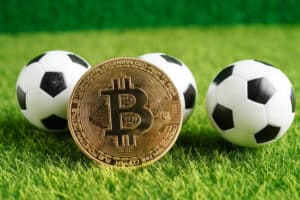 Gold bitcoin with soccer ball or football
