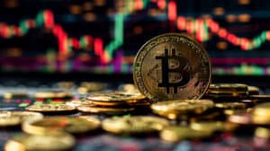Some Bitcoin Symbols and Gold Coins Displayed in Front of Stock Charts.