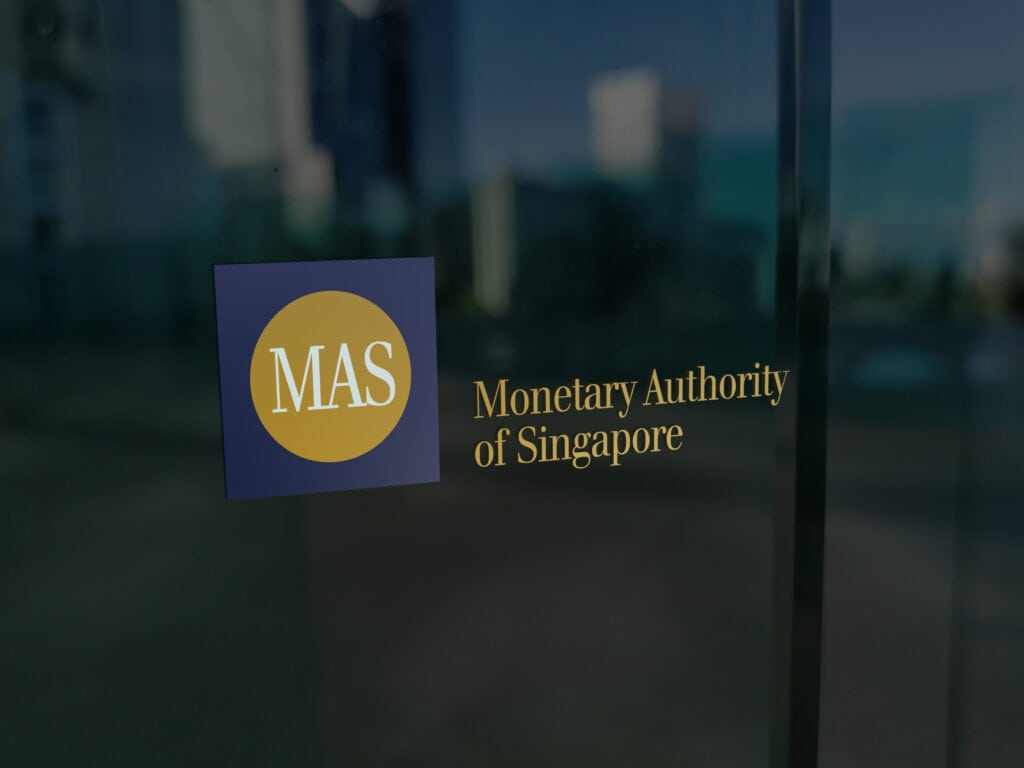 The Logo of Mas Monetary Authority of Singapore on the Administrative Desk Window.