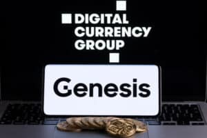 Genesis Global Trading crypto company logo seen on screen of smartphone with bitcoin tokens.