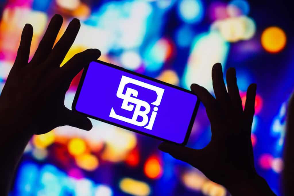 Securities and Exchange Board of India (SEBI) logo is displayed on a smartphone screen.