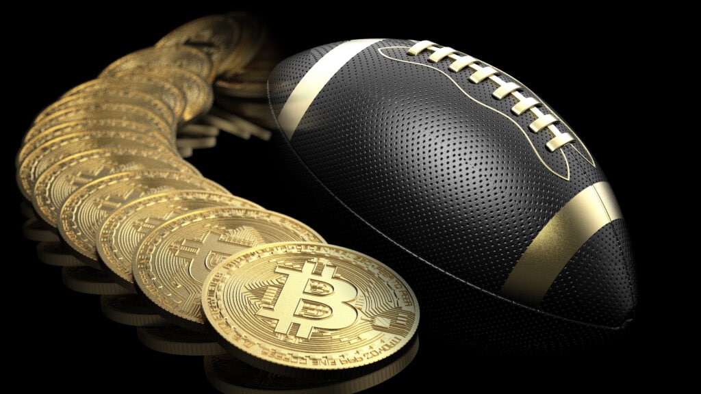 Virtual cryptocurrency money Bitcoin and Black-Gold American Foot Ball.
