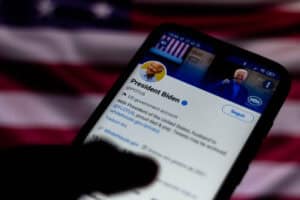 official page of the President of the United States, Joe Biden, on Twitter seen displayed on a smartphone.