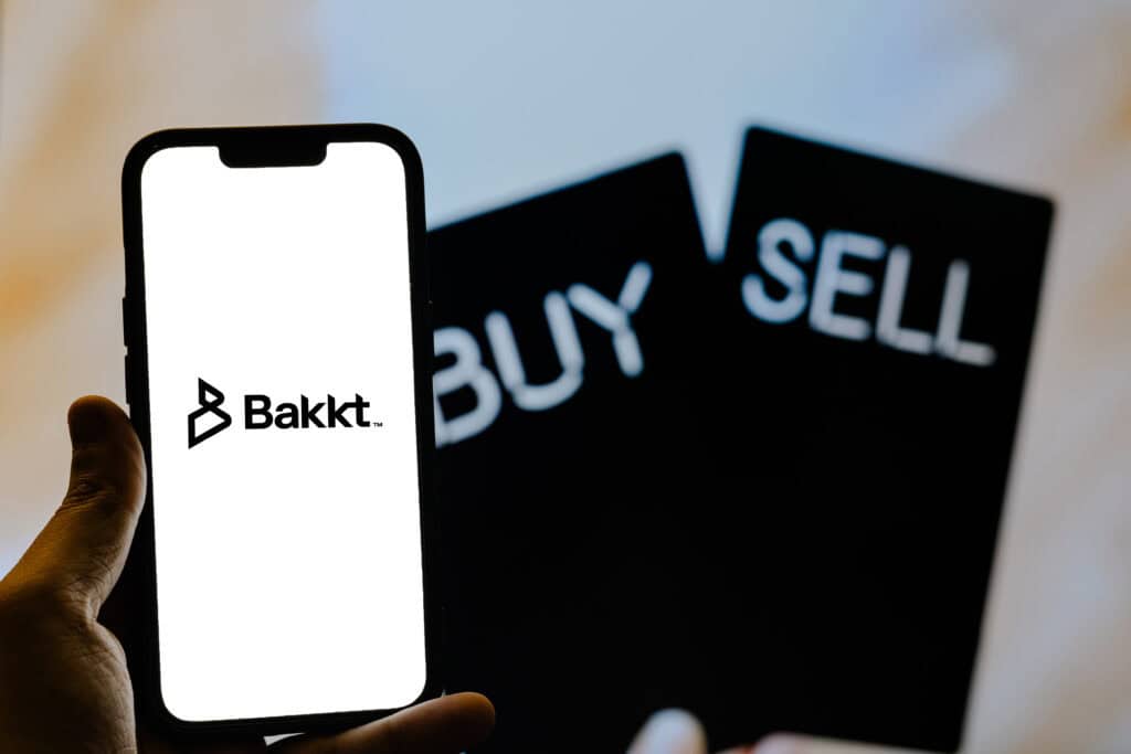 Bakkt company logo on the smartphone screen.