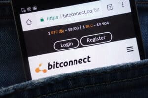 Bitconnect website displayed on smartphone hidden in jeans pocket