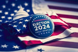 Vote election badge button with text Presidential Election 2024 background, lying at the American flag , vote USA 2024, 3D illustration.