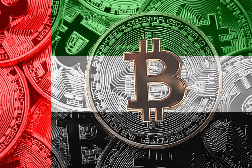 Stack of Bitcoin UAE flag. Bitcoin cryptocurrencies concept. BTC background.