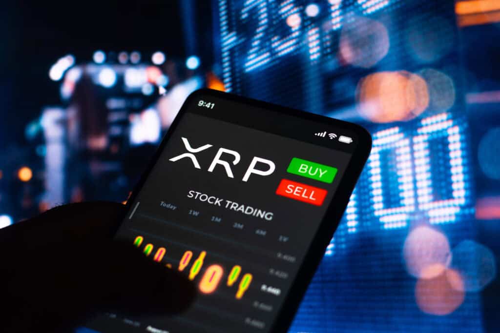 Trading graph of XRP (Ripple) seen on a smartphone screen.